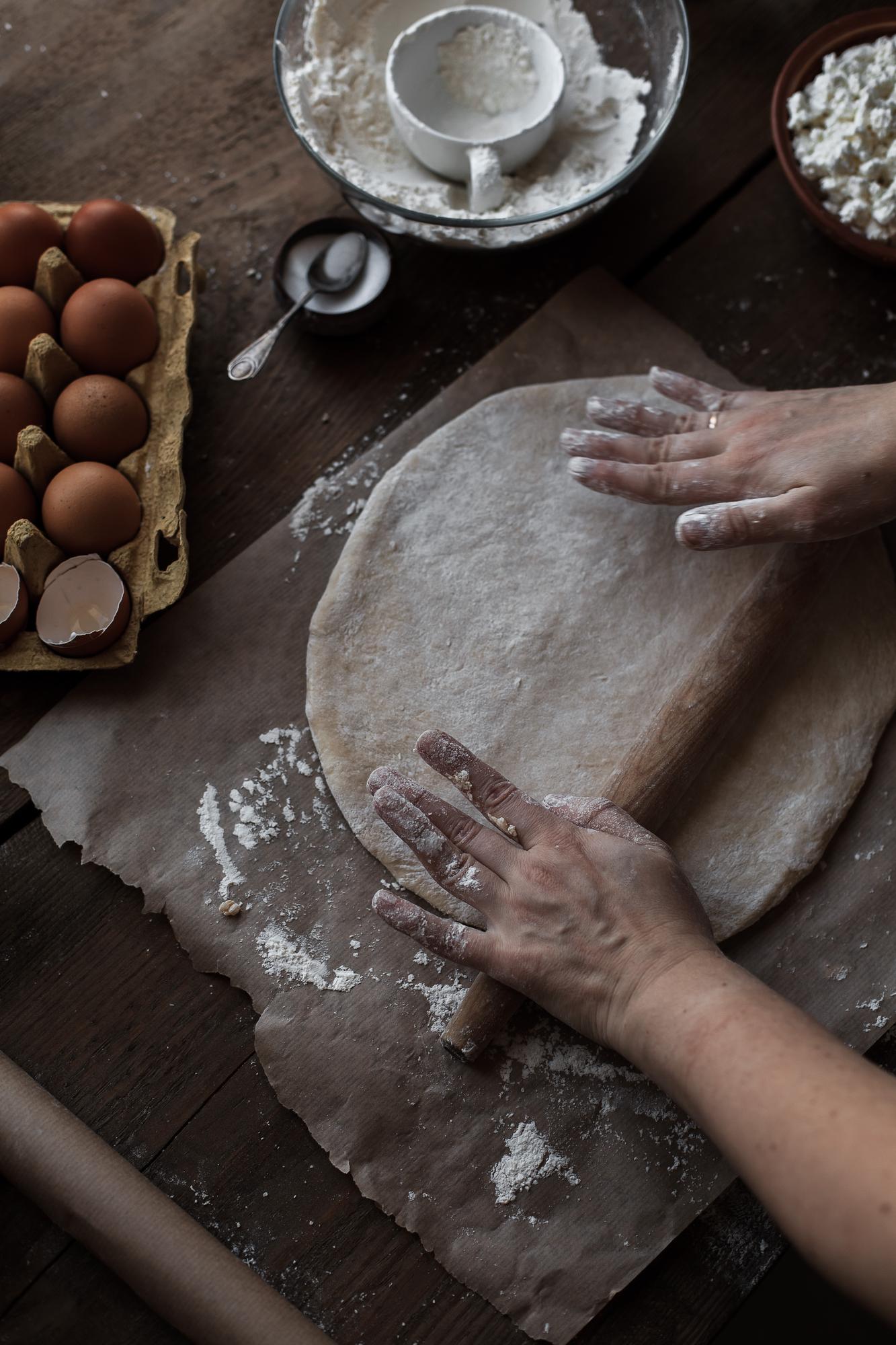 Close-up of hands preparing dough